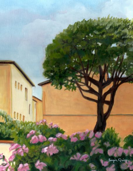 Umbria Garden A tree and pink flowers near buildings under a cloudy sky.