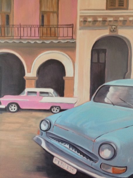 Cuba Cars Vintage cars parked on a cobblestone street with colorful buildings in the background.