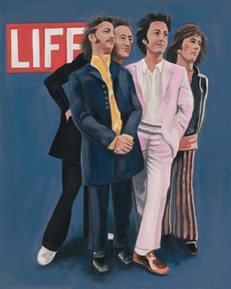 Beatles 1968 Beatles pose confidently against a blue background.